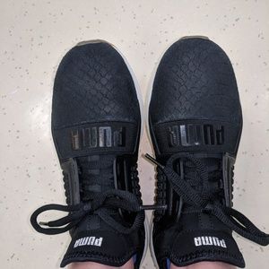 Puma black athletic shoes